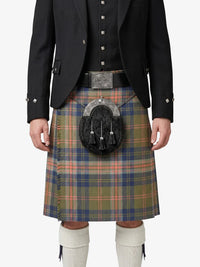 Person wearing a traditional Scottish kilt with a tartan pattern on a white background