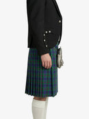 Person wearing a black blazer and green plaid kilt on a white background
