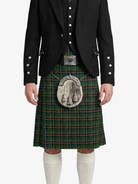 Person wearing a traditional Scottish kilt with a black jacket and white socks on a white background