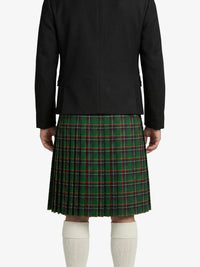 Person wearing a black jacket and green plaid kilt on a white background