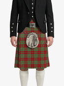Person wearing a traditional Scottish kilt with a jacket on a white background