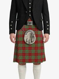 Person wearing a traditional Scottish kilt with a jacket on a white background
