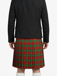 Person wearing a black jacket and red plaid kilt on a white background