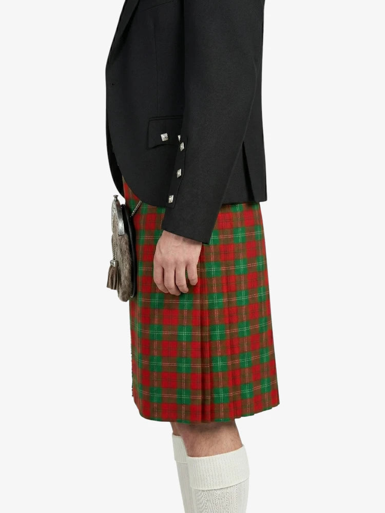 Person wearing a black jacket and red plaid kilt on a white background