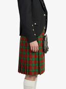 Person wearing a black jacket and red plaid kilt on a white background