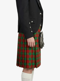 Person wearing a black jacket and red plaid kilt on a white background