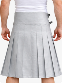Gray pleated skirt worn by a person on a white background