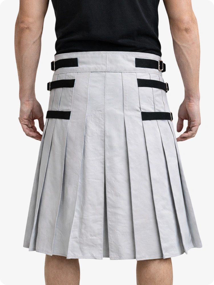 Light Gray pleated kilt with black belt straps worn by a person on a white background