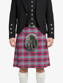 Person wearing a black jacket and red plaid kilt with a silver sporran on a white background