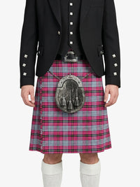 Person wearing a black jacket and red plaid kilt with a silver sporran on a white background
