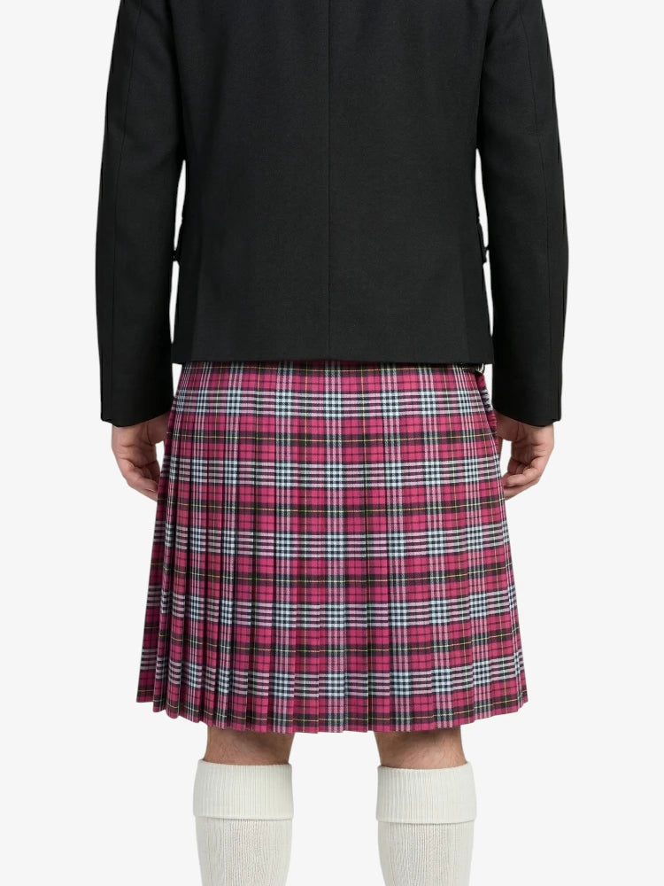 Person wearing a black jacket and pink plaid kilt on a white background