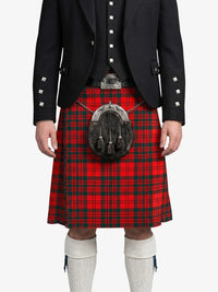Person wearing a red tartan kilt with a black jacket on a white background