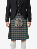 Person wearing a traditional Scottish kilt with a jacket and sporran on a white background