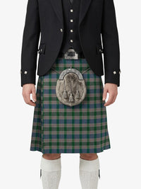 Person wearing a traditional Scottish kilt with a jacket and sporran on a white background