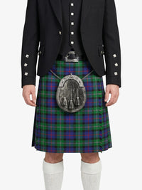Person wearing a Scottish kilt with a tartan pattern on a white background