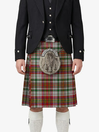 Person wearing a traditional Scottish kilt with a tartan pattern on a white background