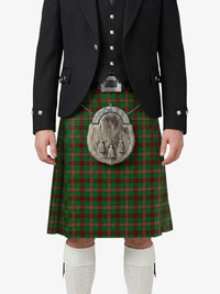 Person wearing a traditional Scottish kilt with a visible tartan pattern on a white background
