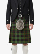 Traditional Scottish kilt with a tartan pattern worn by a person on a white background