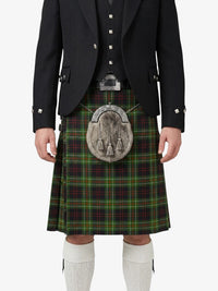 Traditional Scottish kilt with a tartan pattern worn by a person on a white background