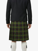 Person wearing a black jacket and green plaid kilt on a white background