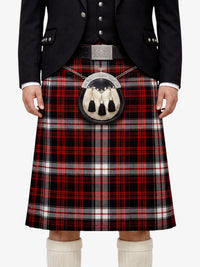 Person wearing a traditional Scottish kilt with a plaid pattern on a white background