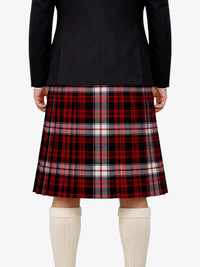 Person wearing a black jacket and red plaid kilt on a white background