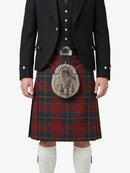 Person wearing a traditional Scottish kilt with a tartan pattern on a white background