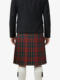 Person wearing a black jacket and red plaid kilt on a white background