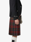 Person wearing a black jacket and red plaid kilt on a white background