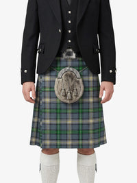 Person wearing a traditional Scottish kilt with a jacket on a white background