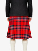 Person wearing a red plaid kilt with a black top on a white background
