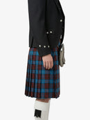 Person wearing a black jacket and blue plaid kilt on a white background