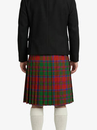 Person wearing a black jacket and red plaid kilt on a white background