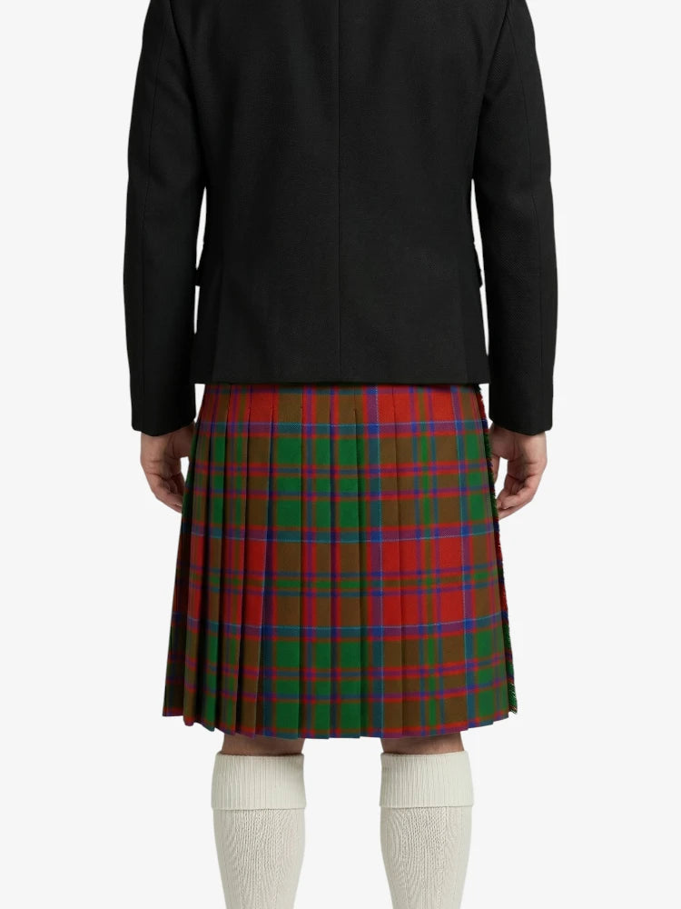 Person wearing a black jacket and red plaid kilt on a white background