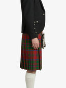 Person wearing a black jacket and red plaid kilt on a white background