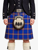 Person wearing a blue plaid kilt with a dark jacket and white knee-high socks on a white background