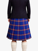 Person wearing a black jacket and blue plaid kilt on a white background