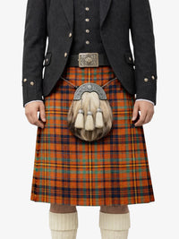 Person wearing a traditional Scottish kilt with a jacket and sporran on a white background