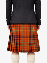 Person wearing a black jacket and orange plaid kilt on a white background