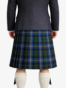 Person wearing a dark gray Jacket and a blue plaid kilt on a white background