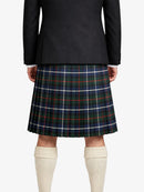 Person wearing a black jacket and plaid kilt on a white background