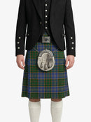 Person wearing a traditional Scottish kilt with a jacket on a white background
