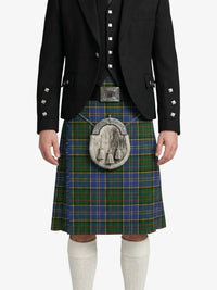 Person wearing a traditional Scottish kilt with a jacket on a white background