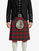 Person wearing a black jacket with silver buttons and a red plaid kilt on a white background