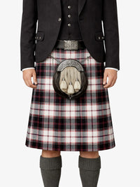 Person wearing a Scottish kilt with a sporran on a white background