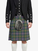 Person wearing a traditional Scottish kilt with a jacket on a white background