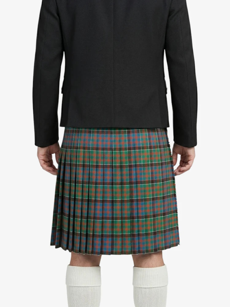 Person wearing a black jacket and plaid kilt on a white background