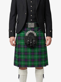 Person wearing a green plaid kilt with a black jacket on a white background