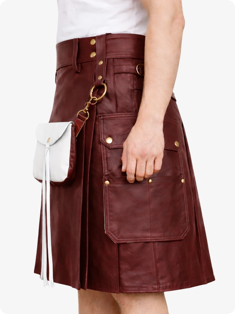 Maroon leather skirt with gold buttons and a white bag on a white background