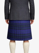 Person wearing a gray coat and blue plaid kilt on a white background